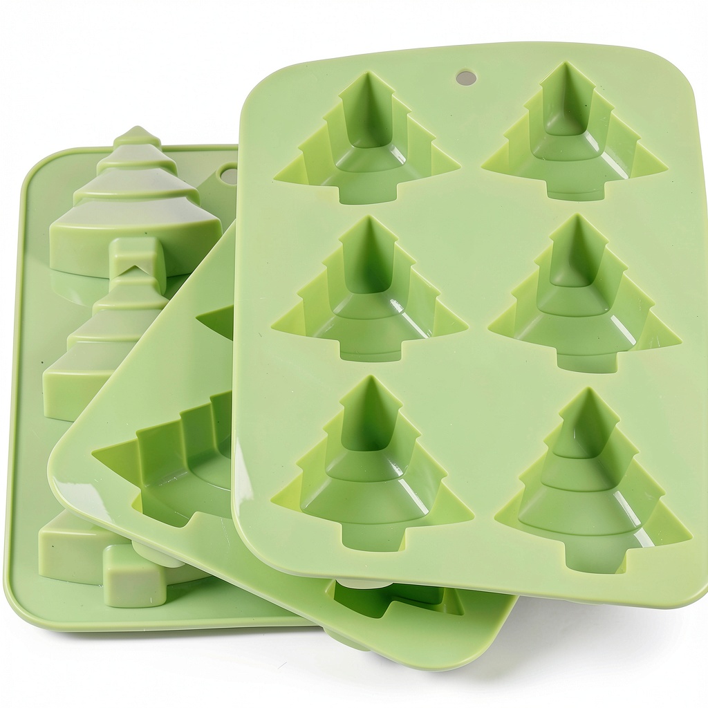 Yabber Christmas Tree silicone molds filled with chocolate on a baking sheet